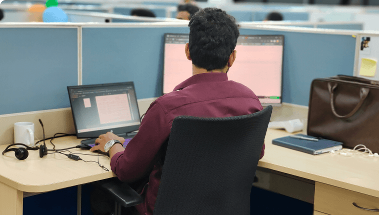 A person sitting in front of a desk